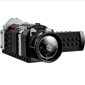 [built-detail] Toy camera made of interlocking bricks on a white background