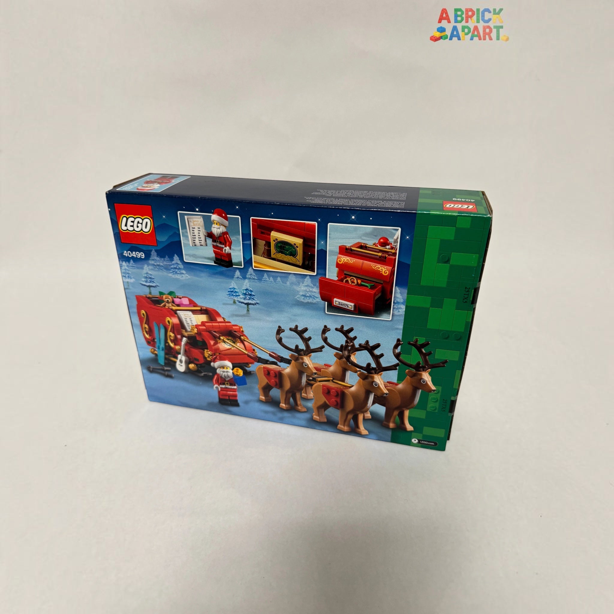 LEGO Christmas set packaging with reindeer and sleigh on a white background