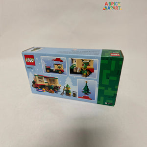 LEGO set packaging with Christmas theme on a light gray background