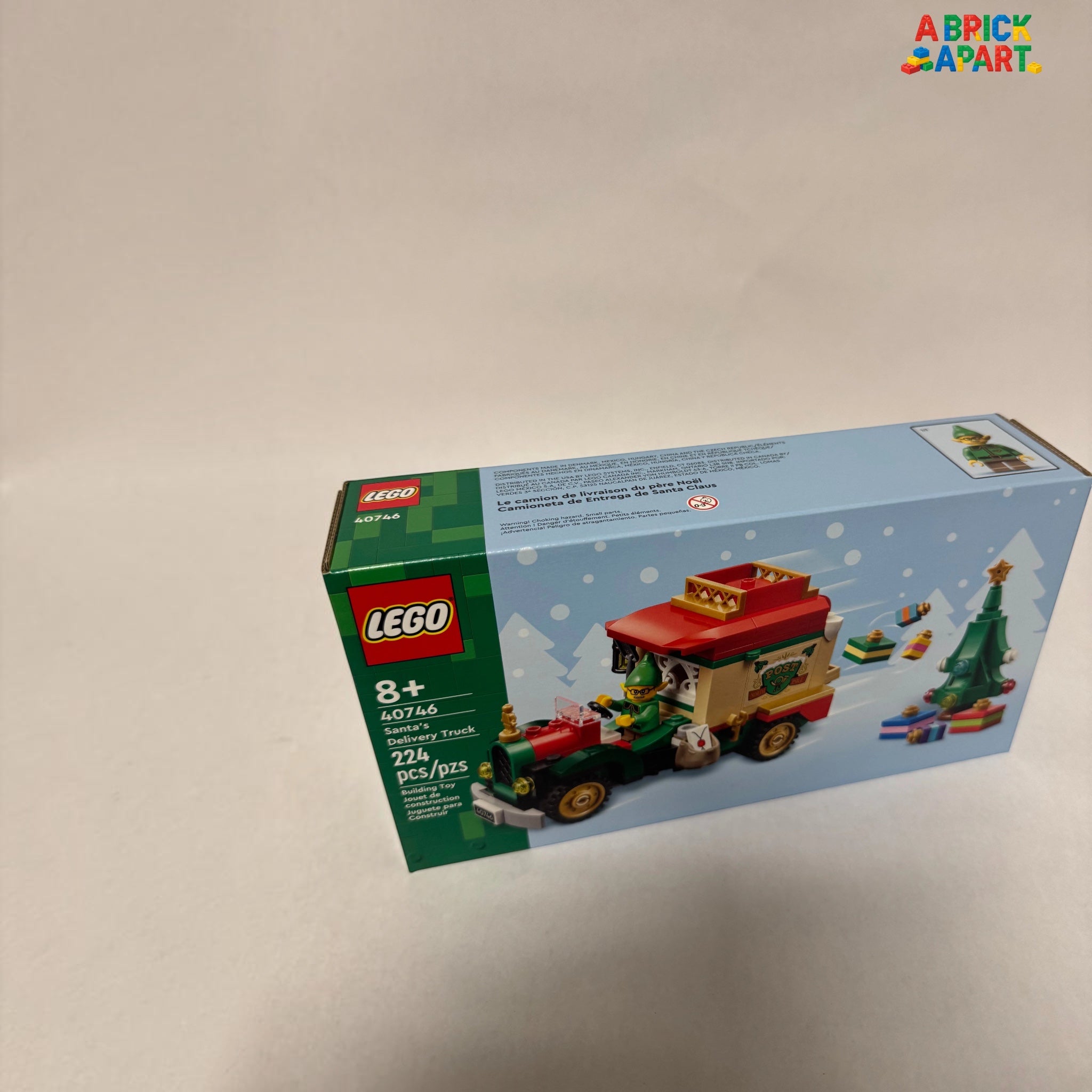 LEGO Christmas truck set packaging on a light gray background