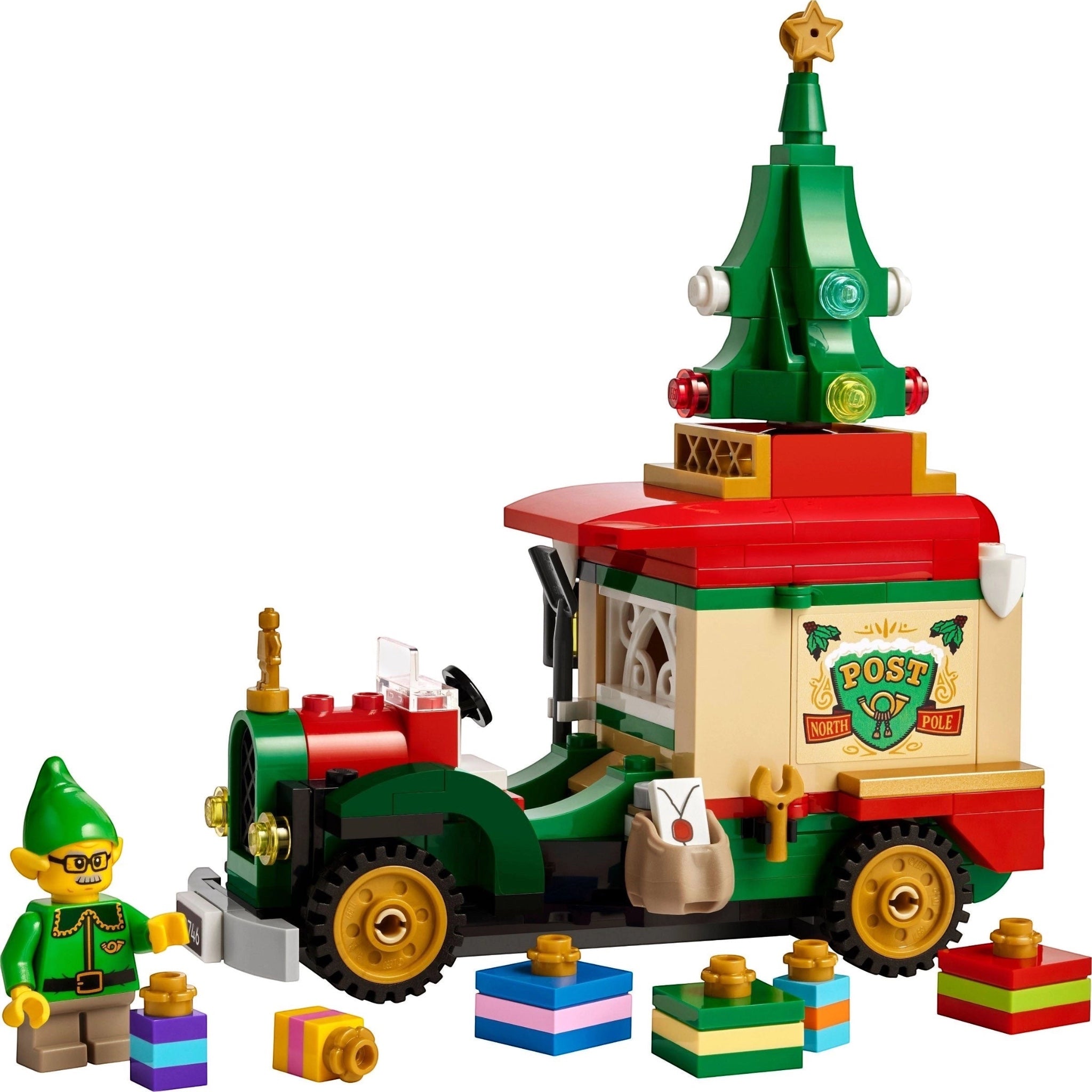 LEGO Christmas train set with a green tree on top and a small figure next to it on a white background.