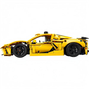 Yellow toy car model on a white background