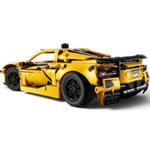 [built-angle] Yellow toy car model on a white background