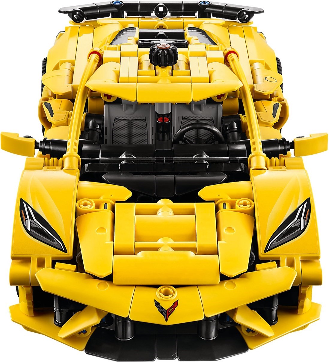 Yellow toy car model with detailed design on a white background