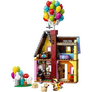 [built-detail] LEGO "Up" House interior cutaway showing living room with TV, phonograph, and furnished rooms alongside Carl, Russell, and Dug figures