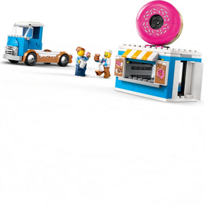 Toy set with a blue truck, donut shop, and figures on a white background