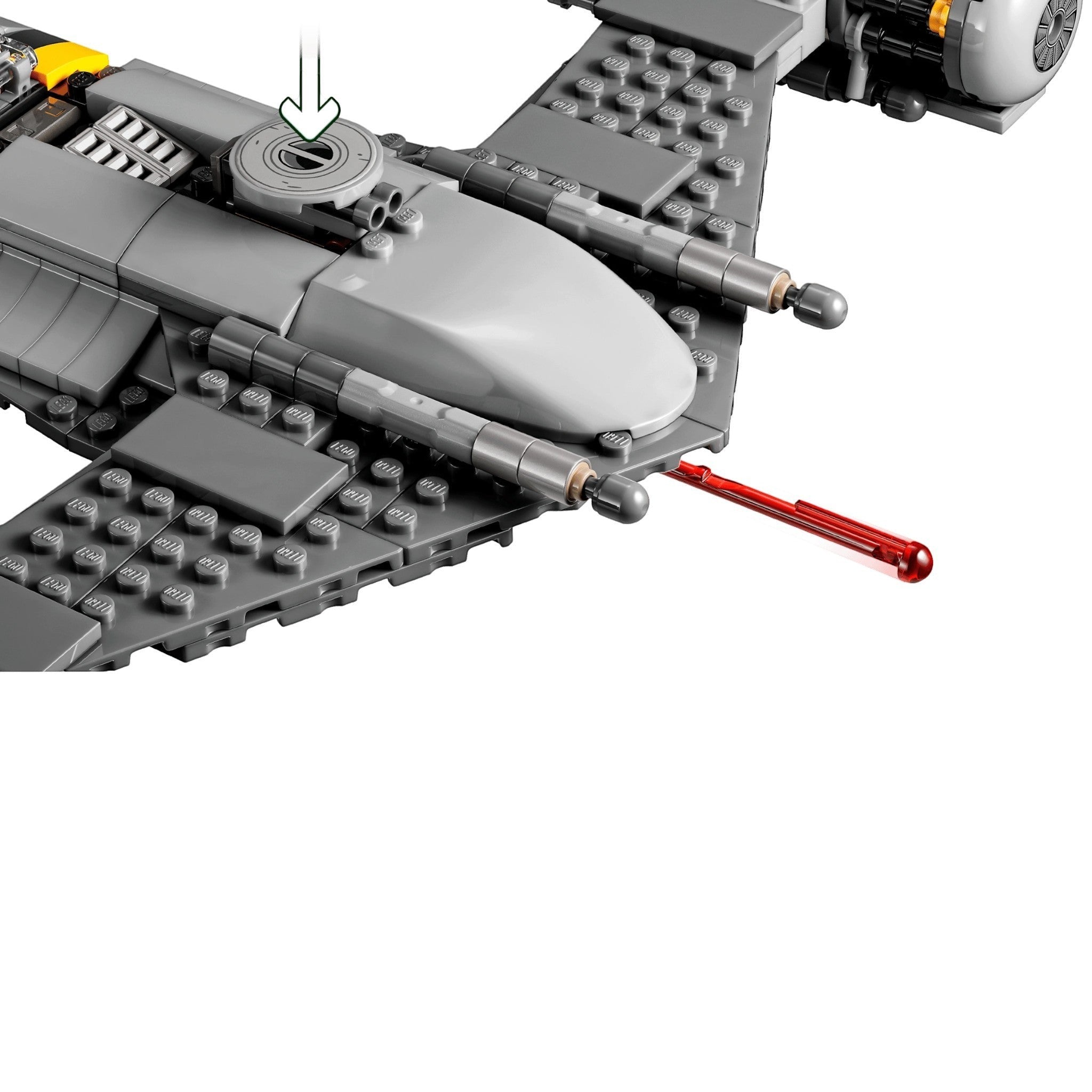 Close-up of a LEGO model of a spaceship with a red laser cannon on a white background