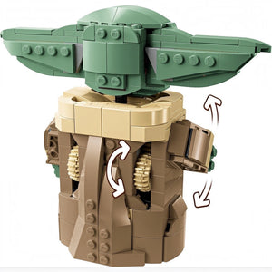 Toy figure of a character with green head and tan body on a white background