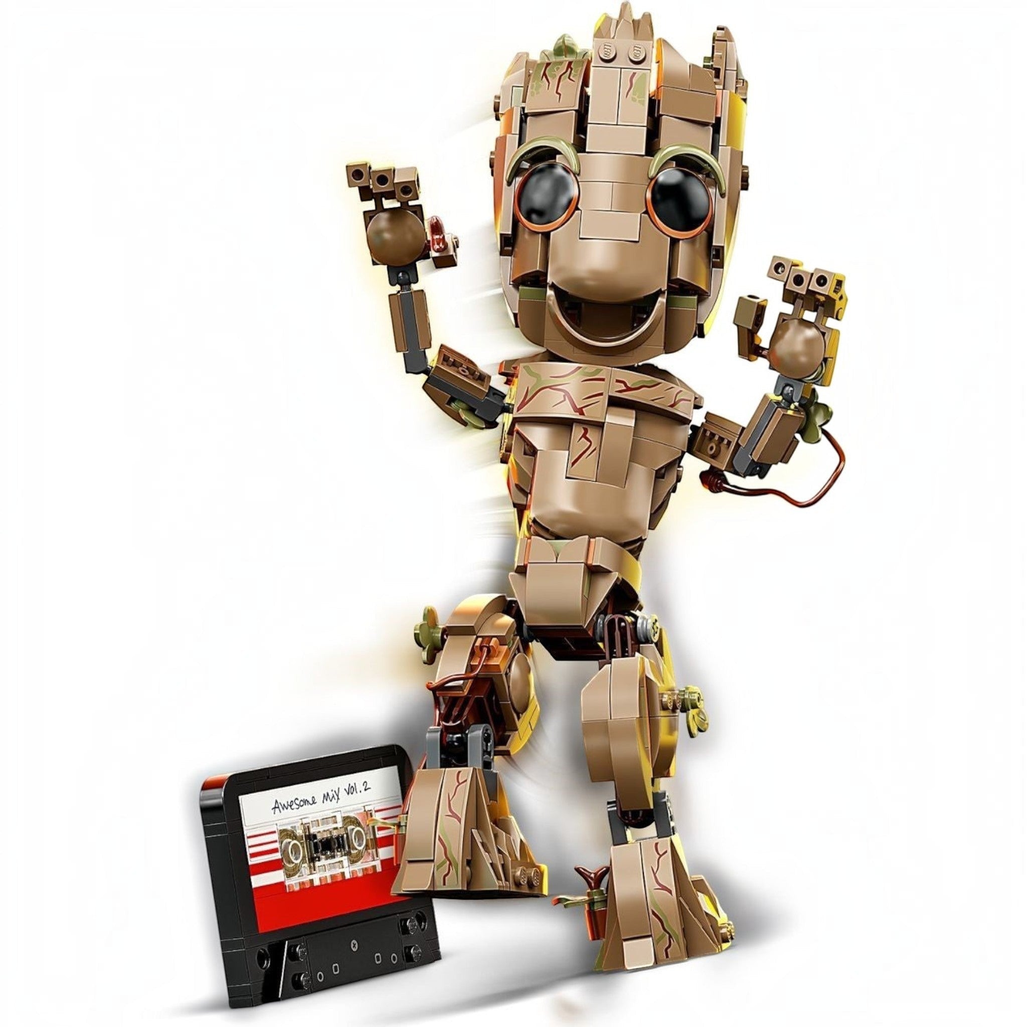 Toy robot figure with a cassette tape on a white background