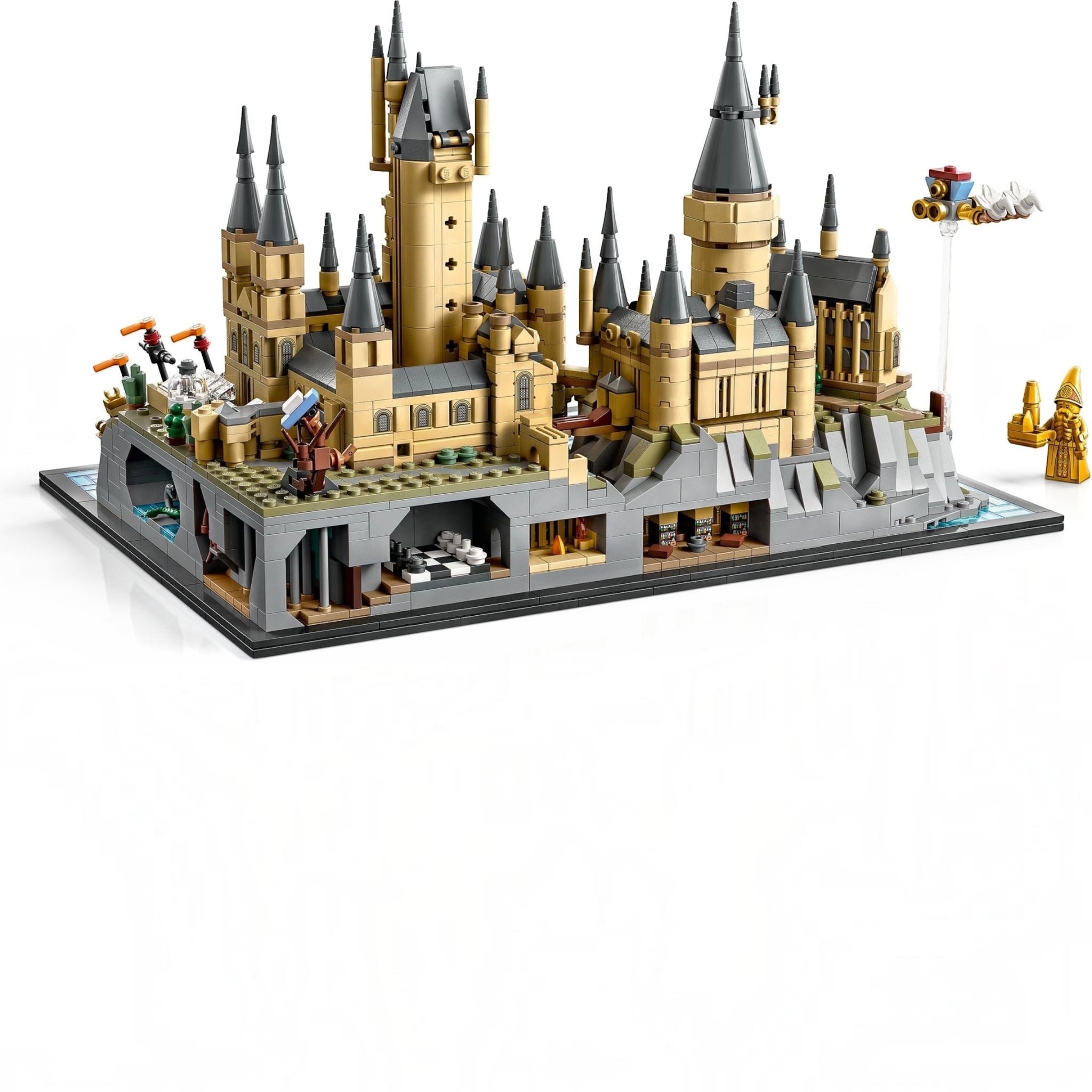 Detailed LEGO model of a castle with multiple towers and structures on a white background