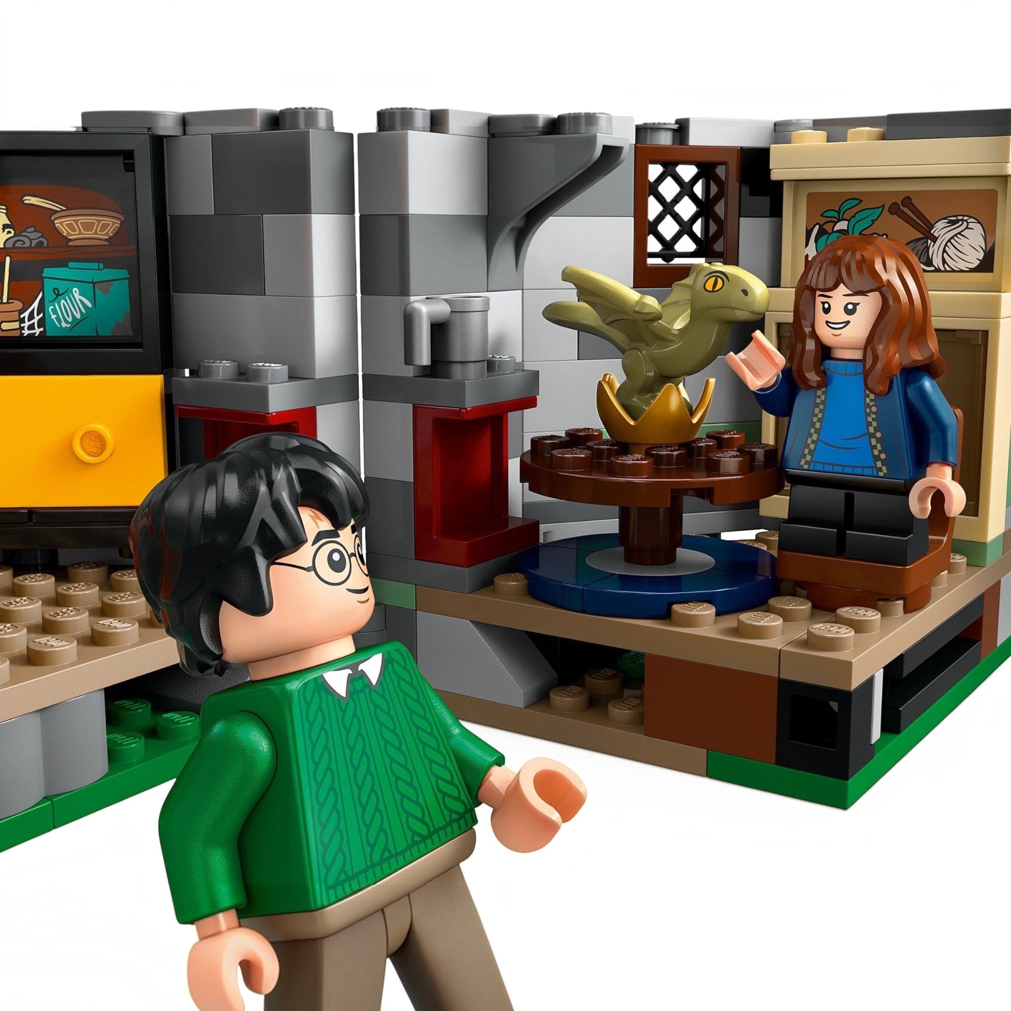 LEGO figures of a boy and girl with a dragon and golden egg in a classroom setting