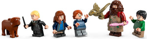 Set of LEGO figurines including a dog, a person with a wand, a person with red hair, a person with a beard, and a person with a green shirt on a white background.
