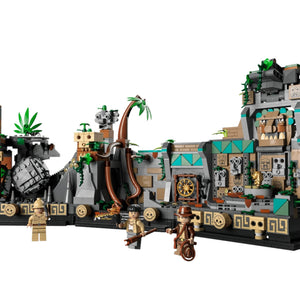 Toy set with a jungle theme featuring buildings, characters, and a dragon-like creature on a white background.