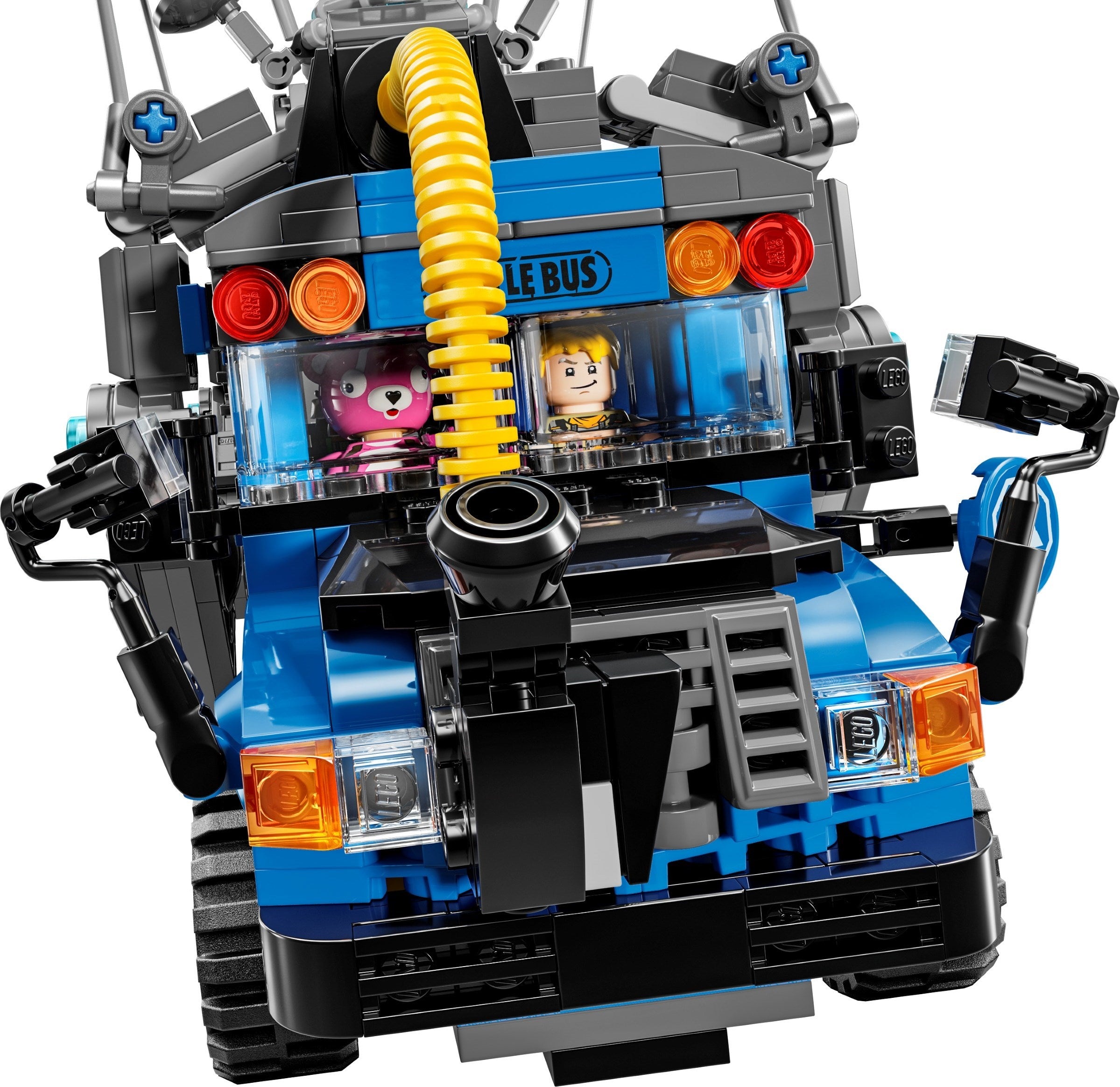 Toy bus made of interlocking bricks with a character inside on a white background