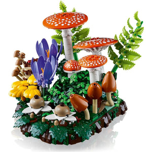 [built-angle] LEGO forest scene with mushrooms, flowers, and animals on a white background