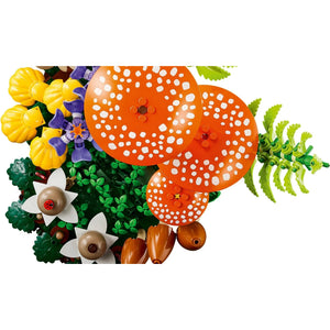 [built-detail] Decorative items including orange polka dot balls, yellow flowers, green leaves, and brown acorns on a white background.