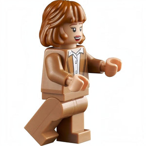 A Brick Apart LEGO Home Alone Kate McCallister minifigure with brown hair and a brown jacket on a white background