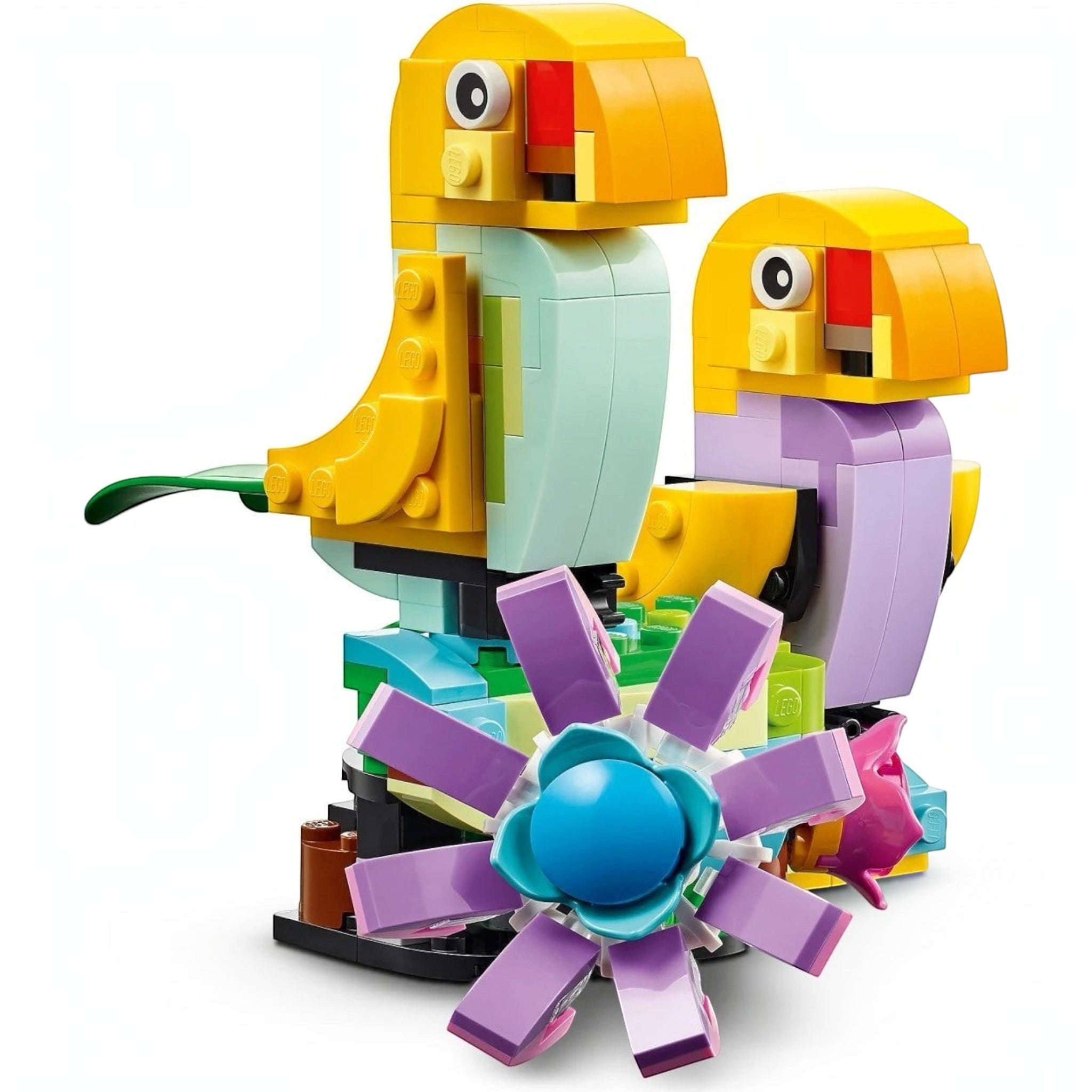 A Brick Apart LEGO Creator 3in1 set featuring two colorful brick-built birds perched on a flower-covered base.
