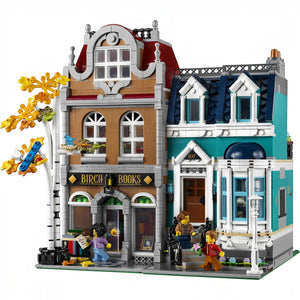 A Brick Apart LEGO Creator Expert Bookshop modular building set with a birch tree, minifigures, and detailed facade.