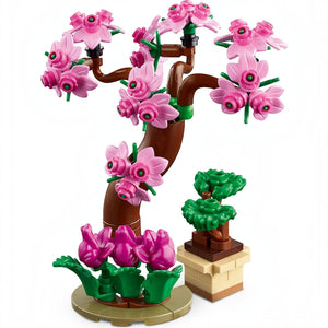 A Brick Apart LEGO Friends Botanical Garden set featuring a pink flowering tree and a small potted bonsai plant.