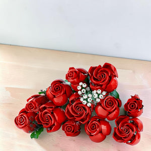 A Brick Apart LEGO Icons Bouquet of Roses set featuring twelve red plastic roses and white baby's breath flowers.