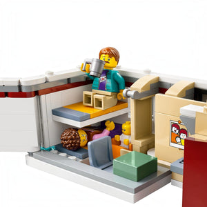 A Brick Apart LEGO City Holiday Camper Van interior showing minifigures in bunk beds with kitchen and baby crib