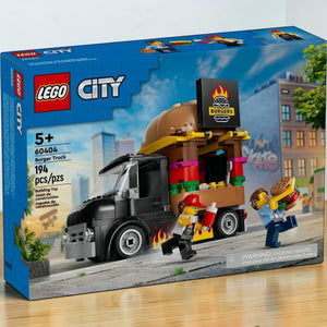 A Brick Apart LEGO City Burger Truck 60404 set box featuring a black food truck with a giant burger sign and minifigures