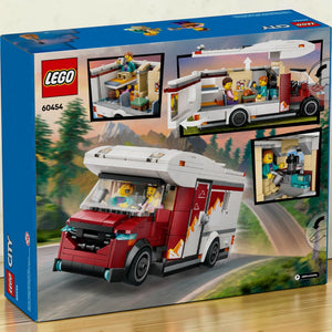 A Brick Apart LEGO City Holiday Camper Van box showing the red and white toy vehicle, interior details, and minifigures.