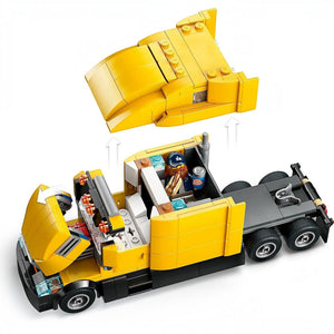 A Brick Apart LEGO City yellow delivery truck with a removable roof and opening hood, featuring a minifigure driver.
