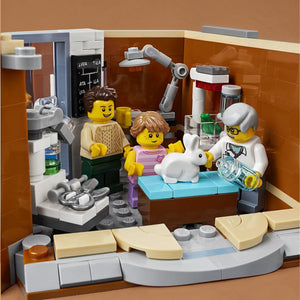 A Brick Apart LEGO Creator Expert Corner Garage animal clinic interior with a vet, two minifigures, and a white rabbit.