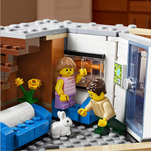 A Brick Apart LEGO Creator Expert Corner Garage apartment interior with two minifigures and a white toy rabbit