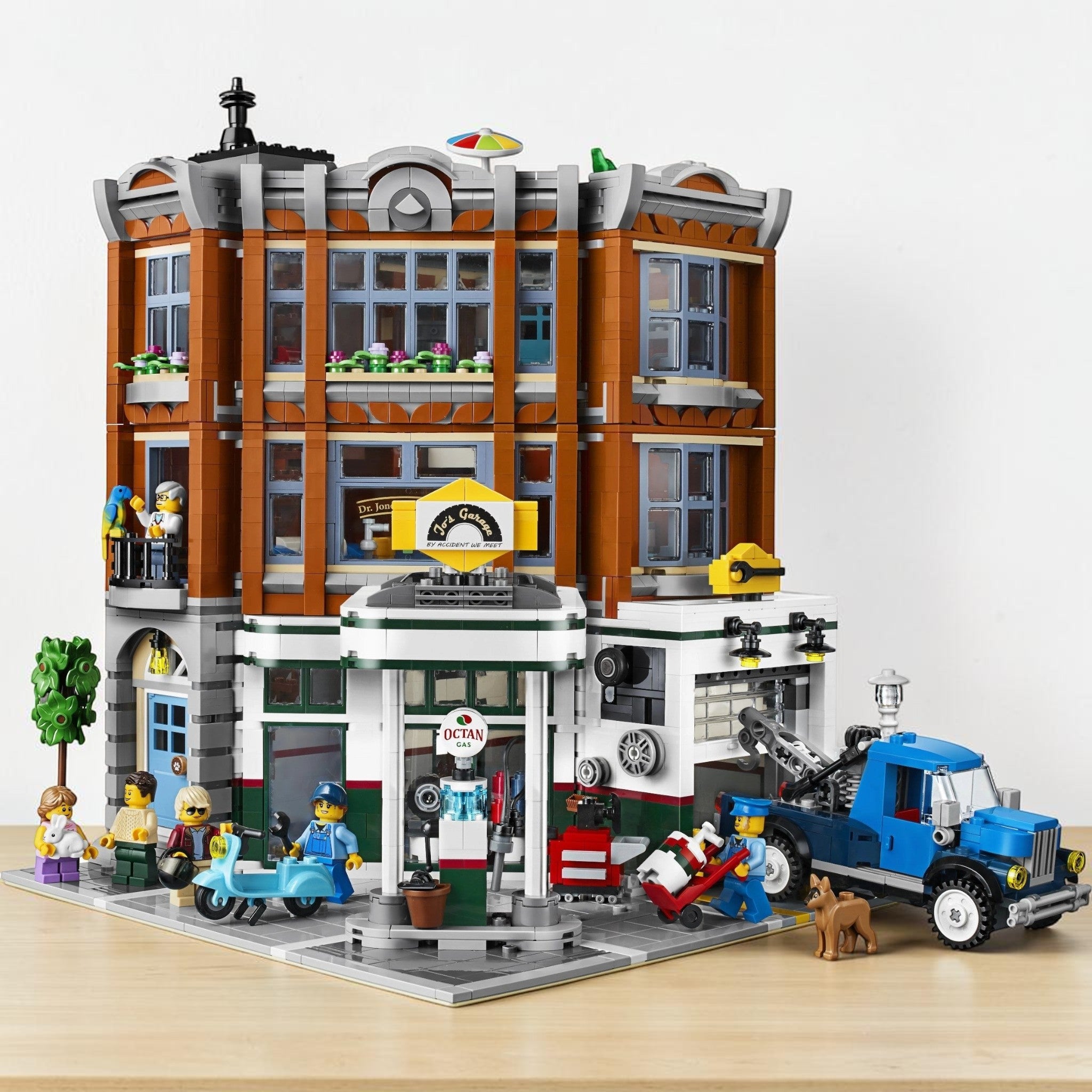A Brick Apart LEGO Creator Expert Corner Garage modular building set with gas station, animal clinic, and apartment.