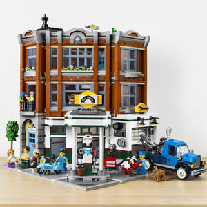 A Brick Apart LEGO Creator Expert Corner Garage modular building set with gas station, animal clinic, and apartment.