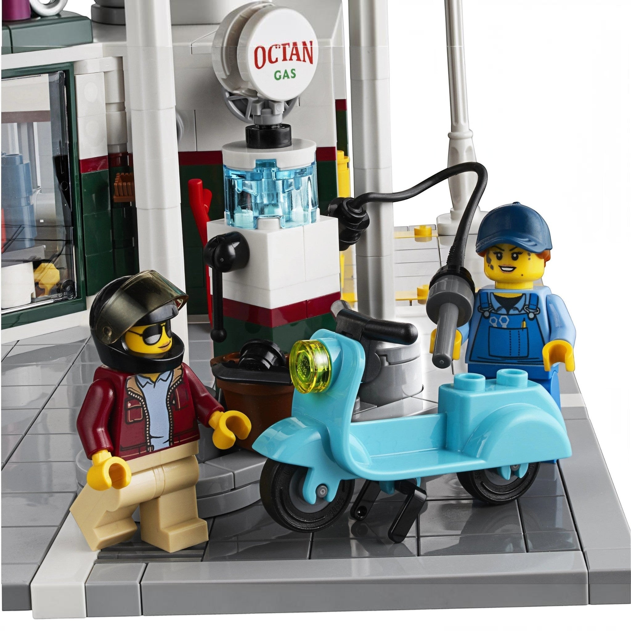 A Brick Apart LEGO Corner Garage set featuring a mechanic minifigure fueling a light blue scooter at an Octan gas pump.