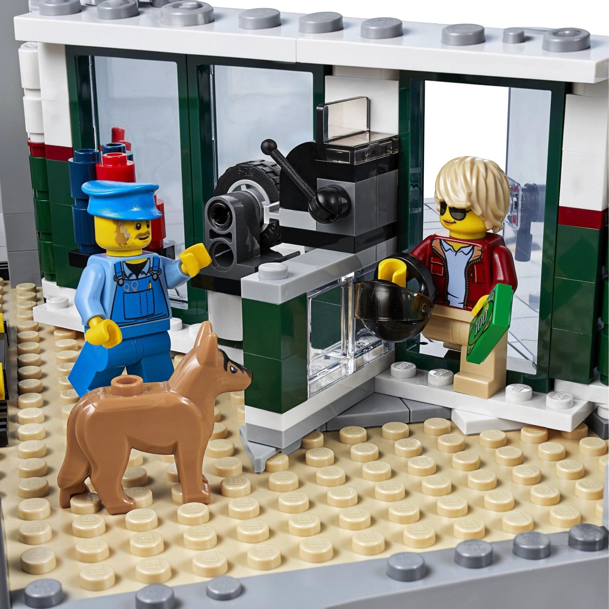 A Brick Apart LEGO Creator Expert Corner Garage mechanic and customer minifigures with a dog in the workshop