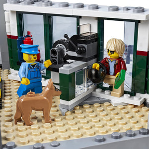 A Brick Apart LEGO Creator Expert Corner Garage mechanic and customer minifigures with a dog in the workshop