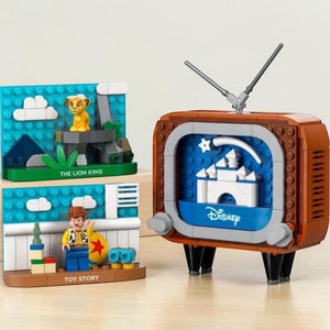 A Brick Apart LEGO Disney Classic Animation Scenes set featuring a retro TV, Simba, and Woody figures.