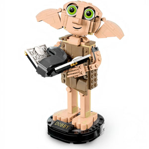 A Brick Apart LEGO Harry Potter Dobby the House-Elf figure holding Tom Riddle's diary on a black display stand.