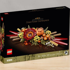 A Brick Apart LEGO Icons Dried Flower Centrepiece box featuring a fall-inspired floral arrangement with gerbera and rose.