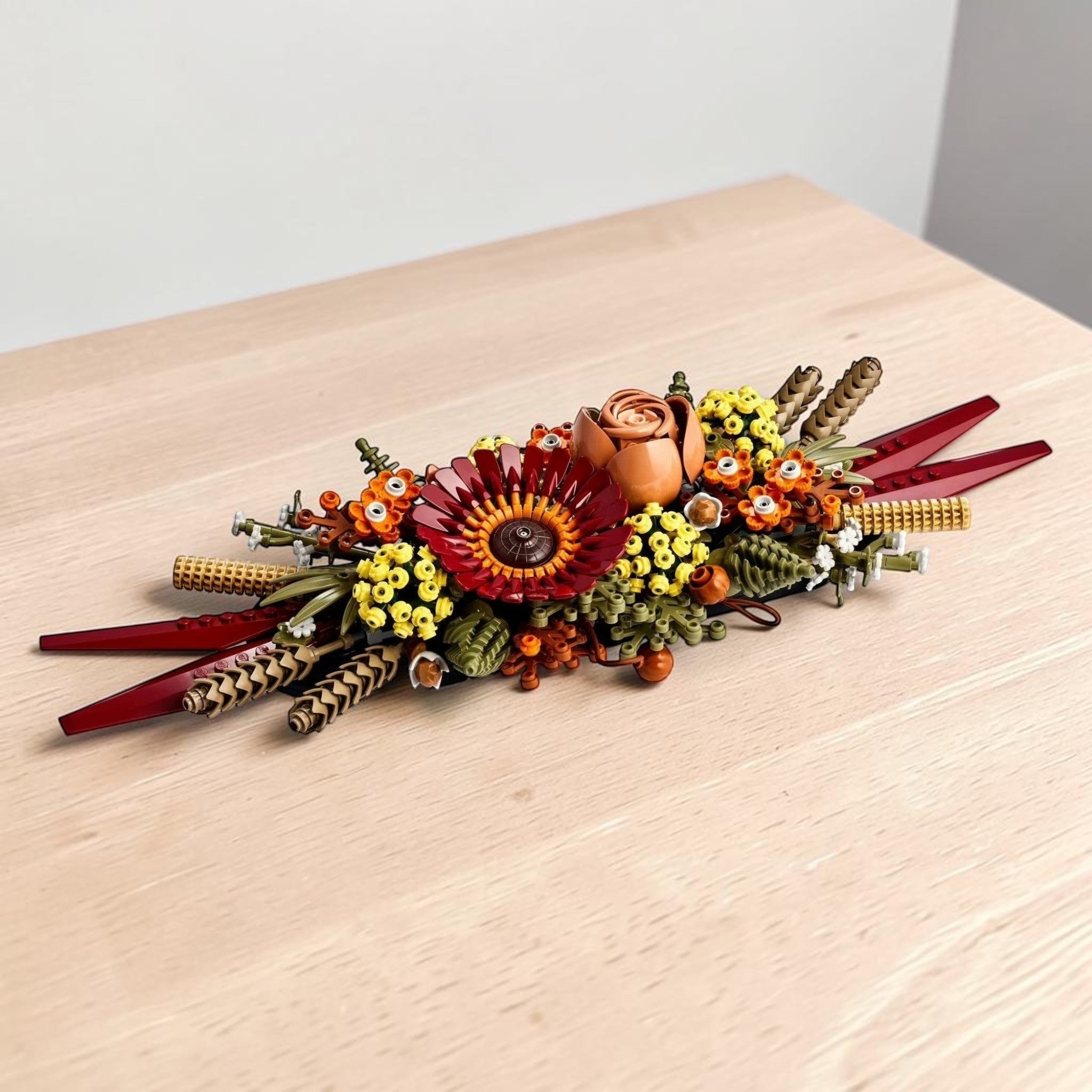 A Brick Apart LEGO Icons Dried Flower Centrepiece featuring a vibrant fall-inspired floral arrangement with a box.