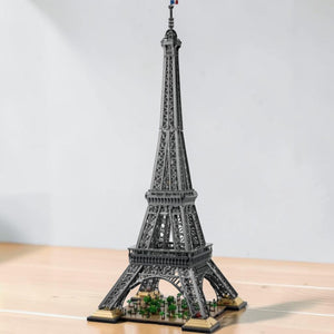 [lifestyle-shelf-built] A Brick Apart LEGO Icons Eiffel Tower model featuring intricate grey lattice steel structure and French flag detail.