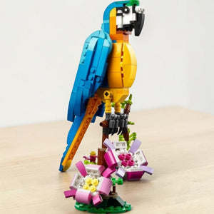 A Brick Apart LEGO Creator Exotic Parrot 3in1 set featuring a posable blue and yellow bird perched on a flower base.