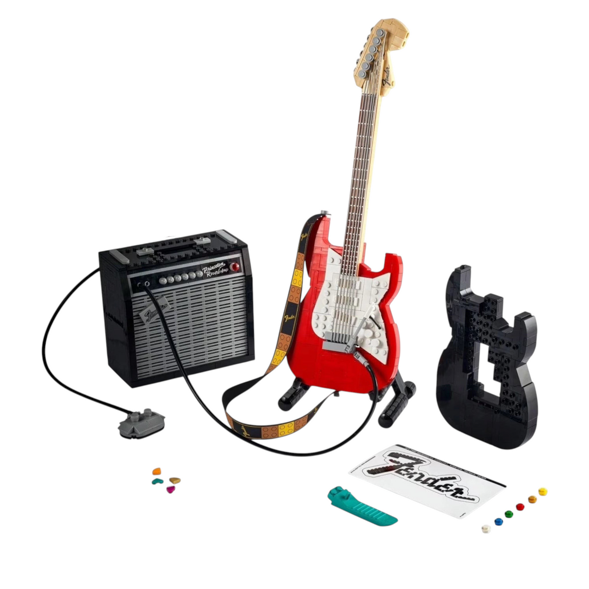 [lifestyle-shelf-built] A Brick Apart LEGO Ideas Fender Stratocaster set featuring a red guitar, black amplifier, and interchangeable parts.