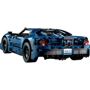 [built-angle] A Brick Apart LEGO Technic 2022 Ford GT model seen from the rear, showcasing the dark blue body and detailed taillights.