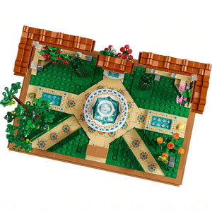 A Brick Apart LEGO Icons Fountain Garden building set with a tiered fountain, tiled pathways, and colorful flowers.