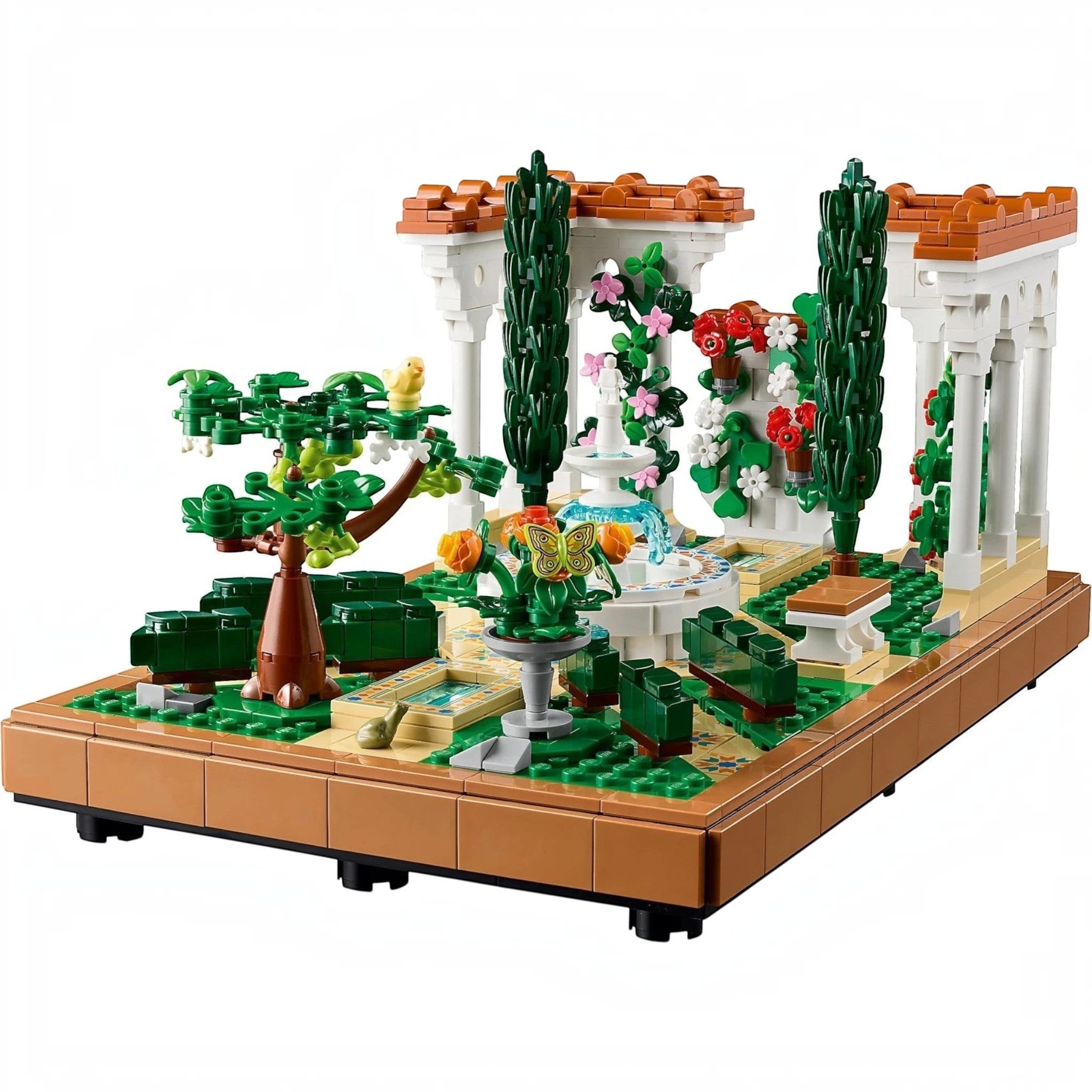 A Brick Apart LEGO Icons Fountain Garden building set featuring a tiered fountain, cypress trees, and colorful flowers.