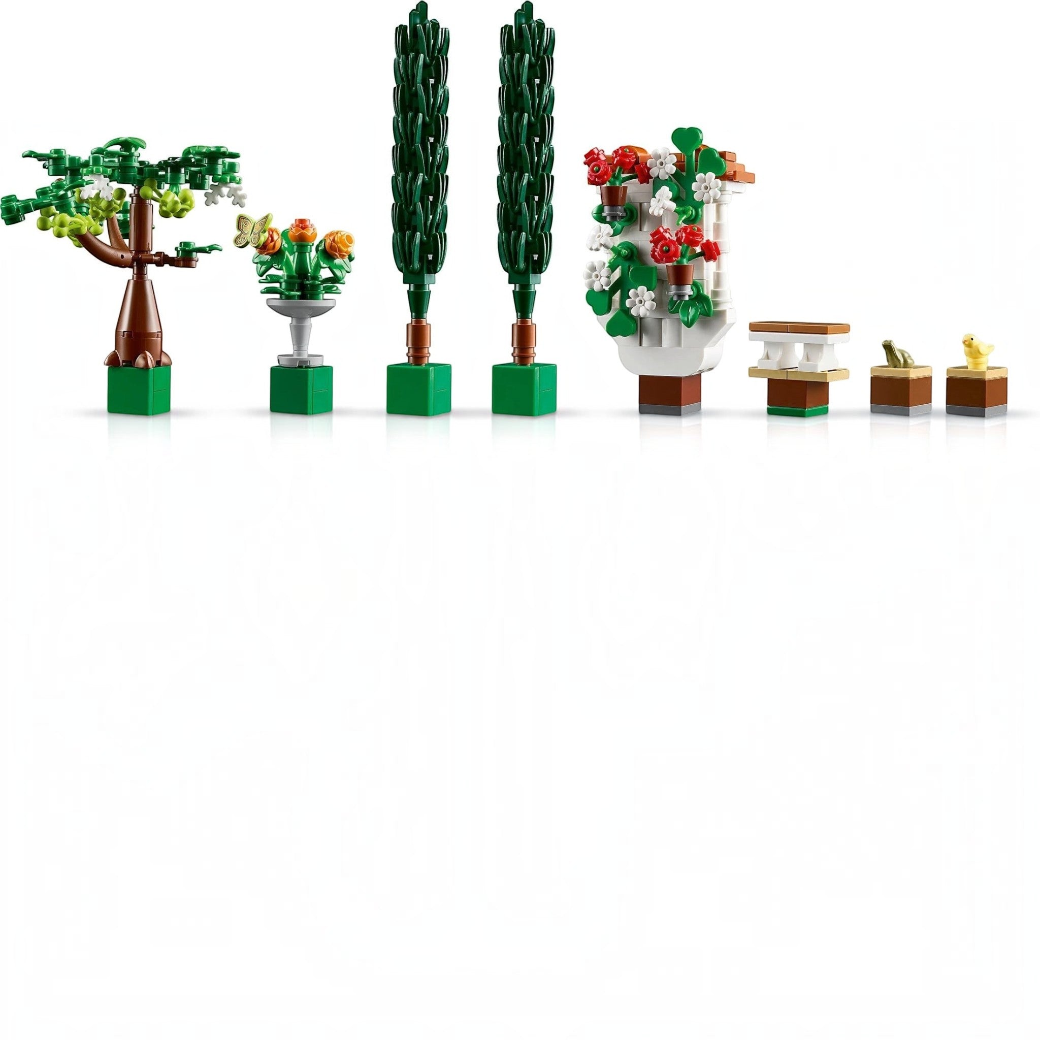 A Brick Apart LEGO Icons Fountain Garden set featuring miniature trees, a fountain, flowers, and animal figures.