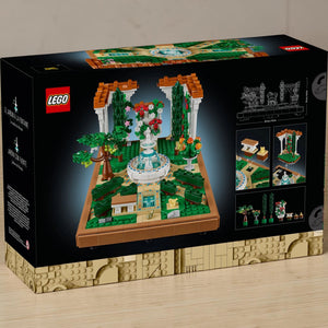 A Brick Apart LEGO Icons Fountain Garden building set box showing the completed tiered fountain and floral landscape.