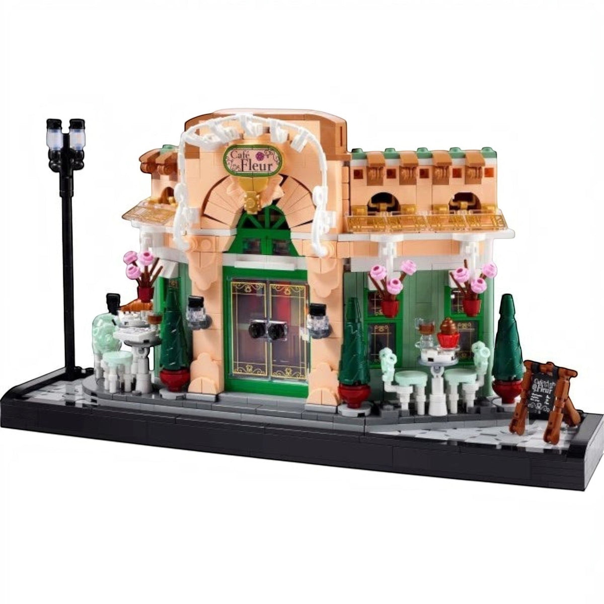 [built-white] A Brick Apart LEGO Icons French Café set featuring a detailed bistro facade with flowerpots, seating, and streetlamp.
