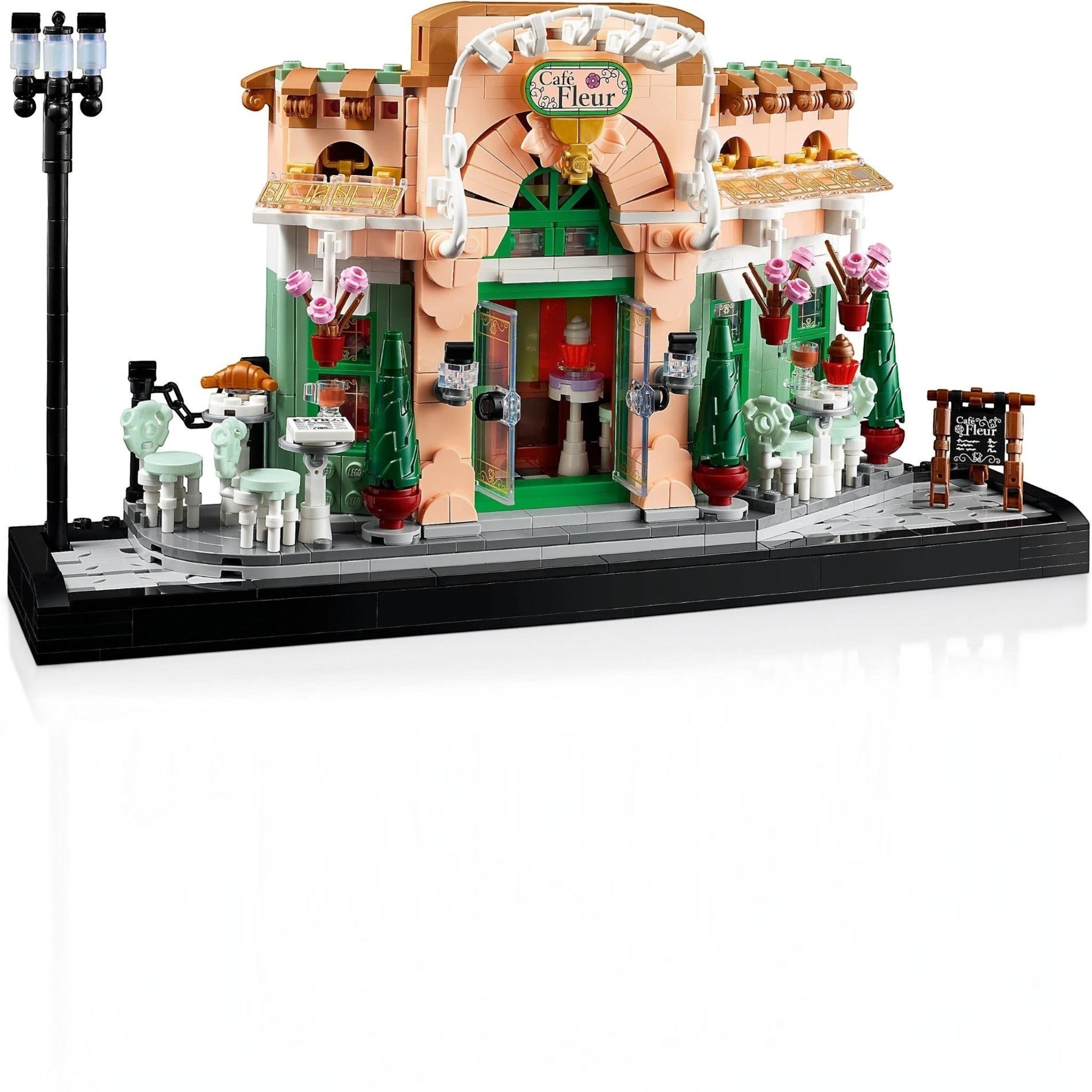 A Brick Apart LEGO Icons French Café building set featuring a detailed bistro facade, outdoor seating, and streetlamp.